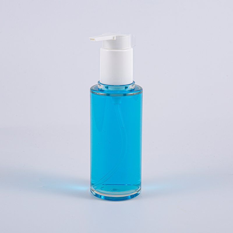 Kirkas PETG 100 ml:n pyöreä voidepullo valkoisella muovipumpulla